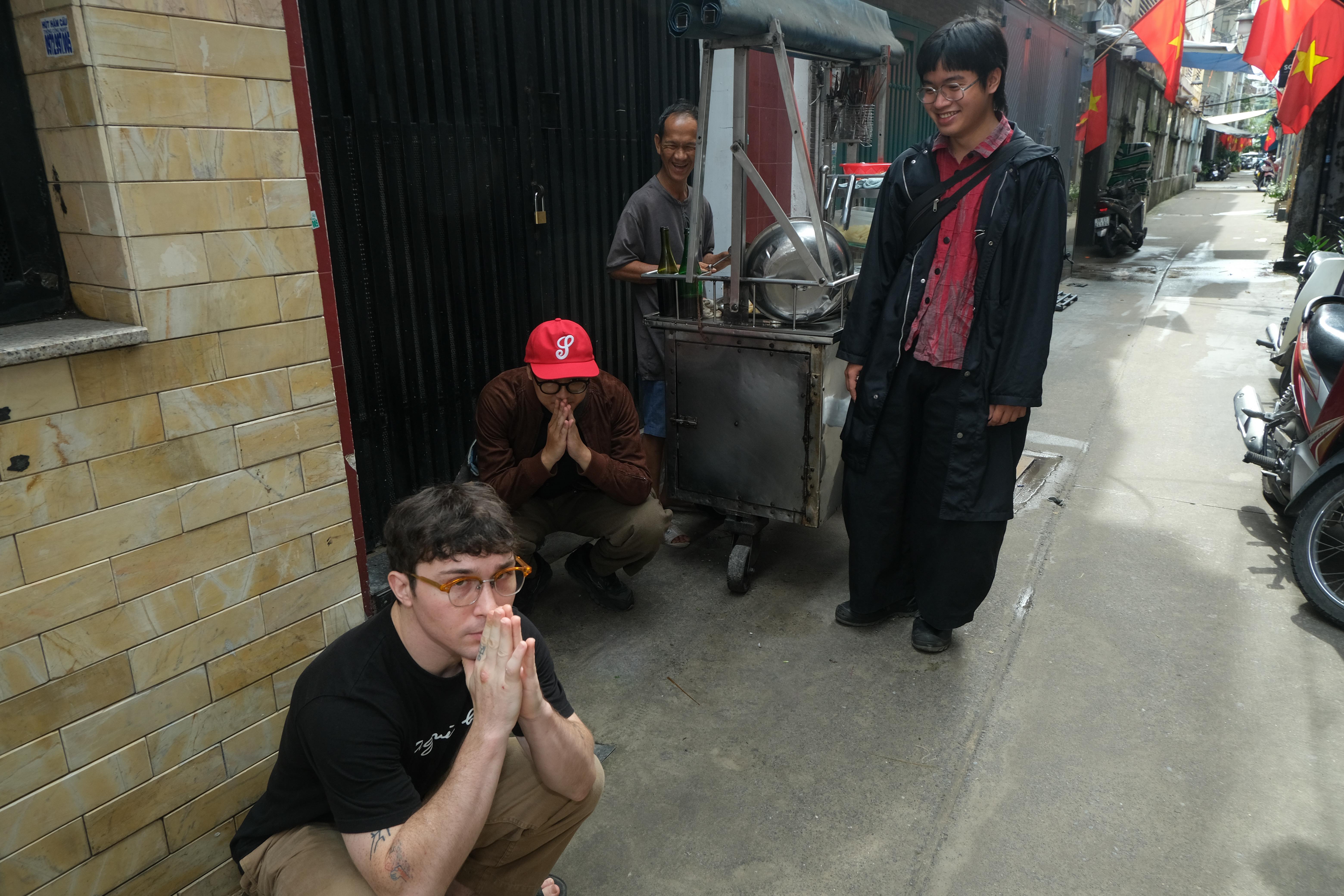 Three members of Rắn Cạp Đuôi on the streets of Ho-Chi Minh City